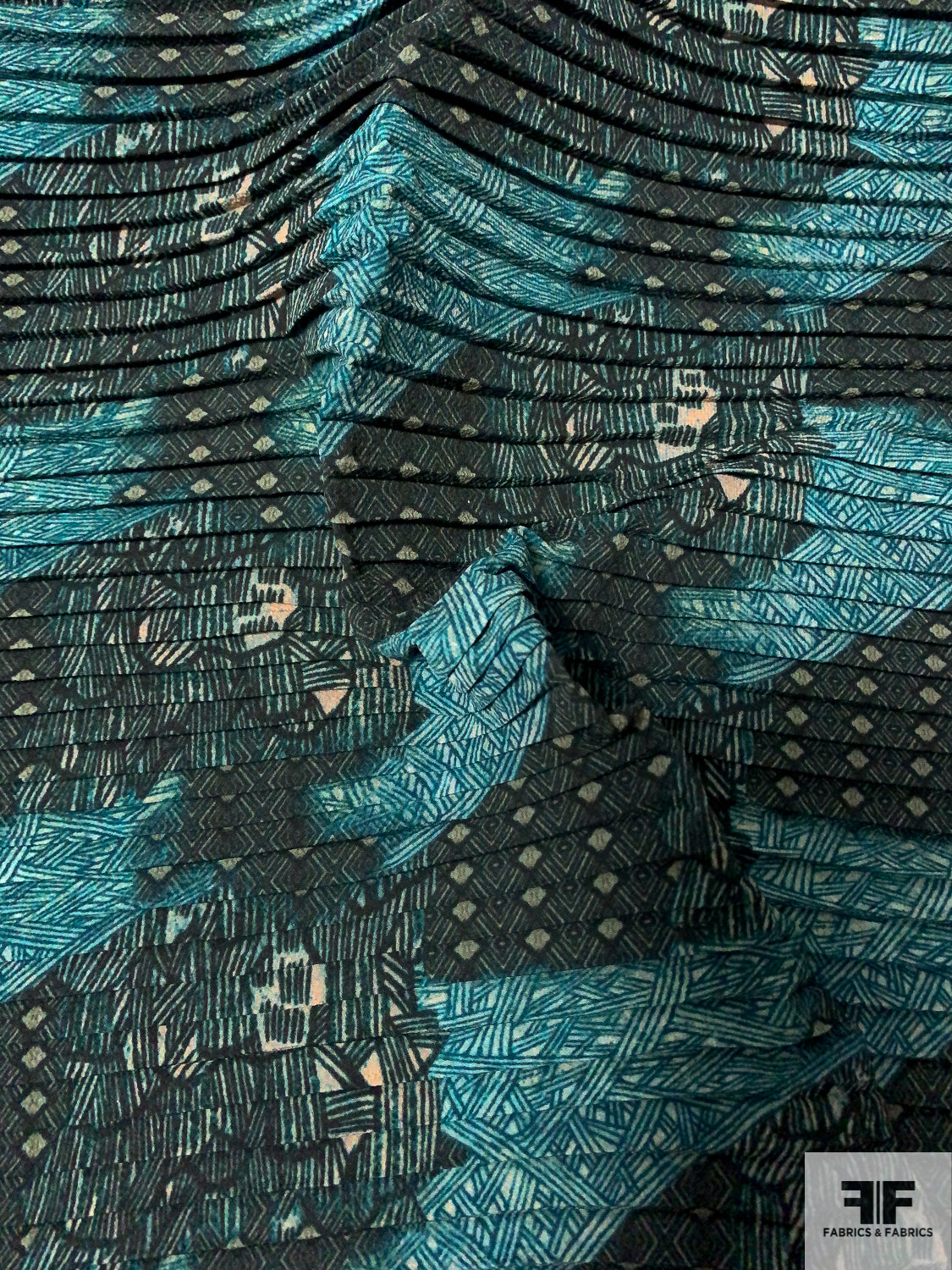 Abstract Printed Pleated Polyester Georgette - Shades of Teal / Blush