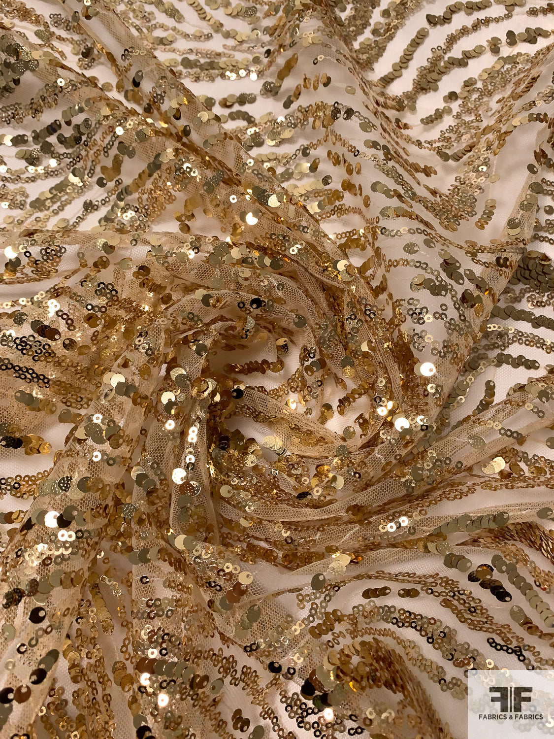 Gold Sequins in Wavy Striation Design on Nude Tulle - Gold | FABRICS & FABRICS Fabrics & Fabrics Gold Sequins in Wavy Striation Design on Nude Tulle - Gold | FABRICS & FABRICS Fabrics & Fabrics