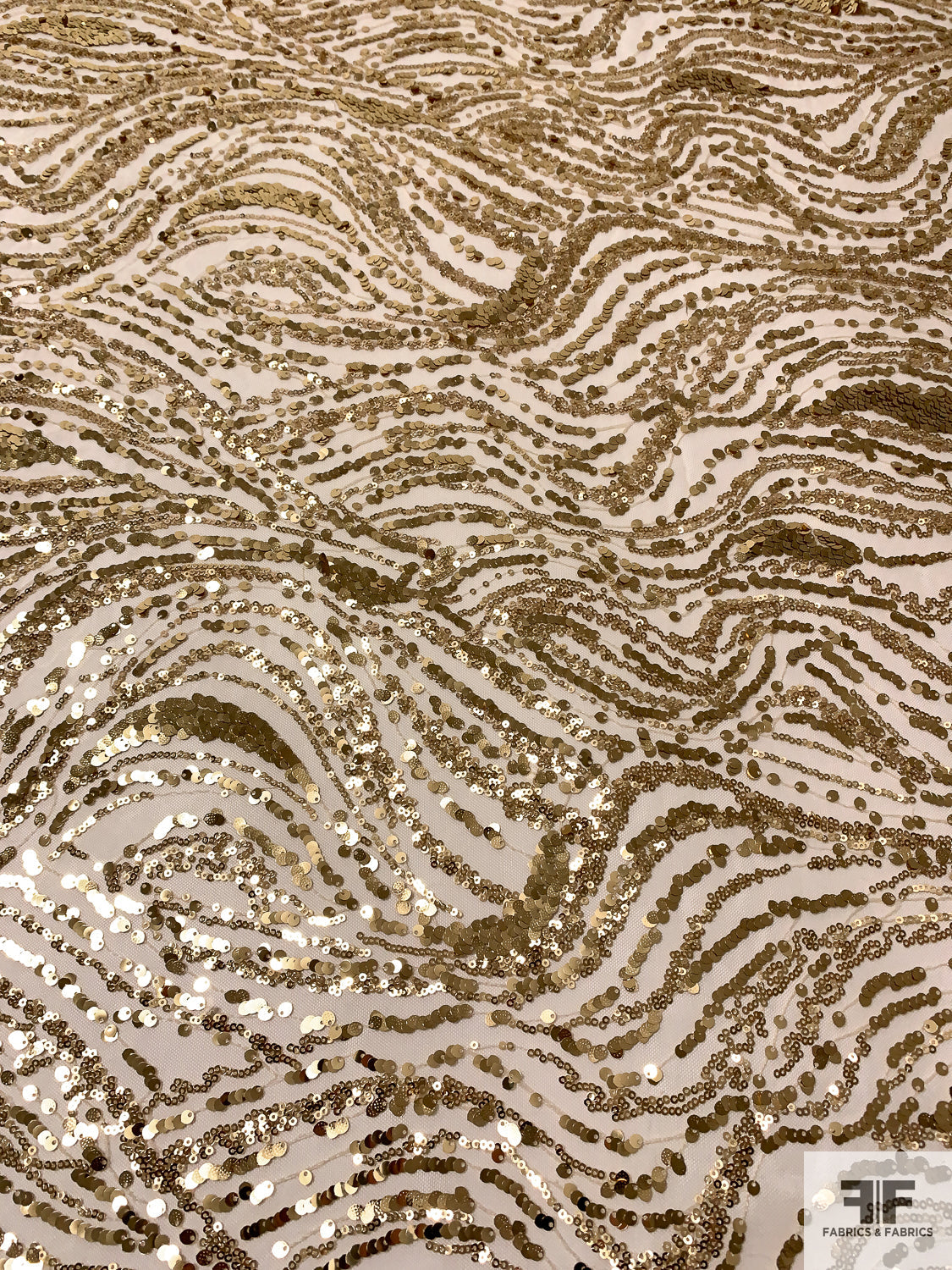 Gold Sequins in Wavy Striation Design on Nude Tulle - Gold | FABRICS & FABRICS Fabrics & Fabrics Gold Sequins in Wavy Striation Design on Nude Tulle - Gold | FABRICS & FABRICS Fabrics & Fabrics