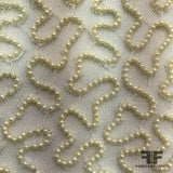 Couture Swivel Beaded Netting - Ivory - Fabrics & Fabrics NY